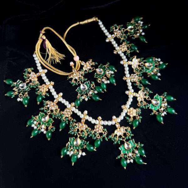 Long haar with pearls and beads green colour bridal set with earrings